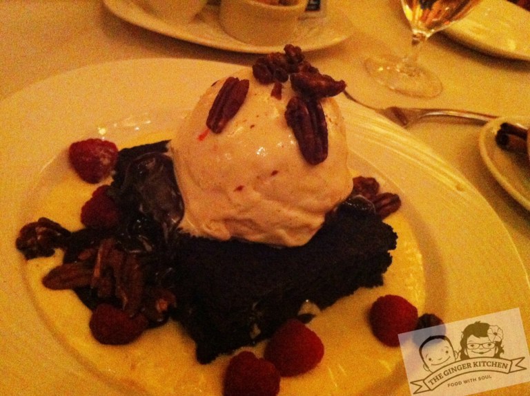Flaming Chambord Brownie with raspberries and candied pecans